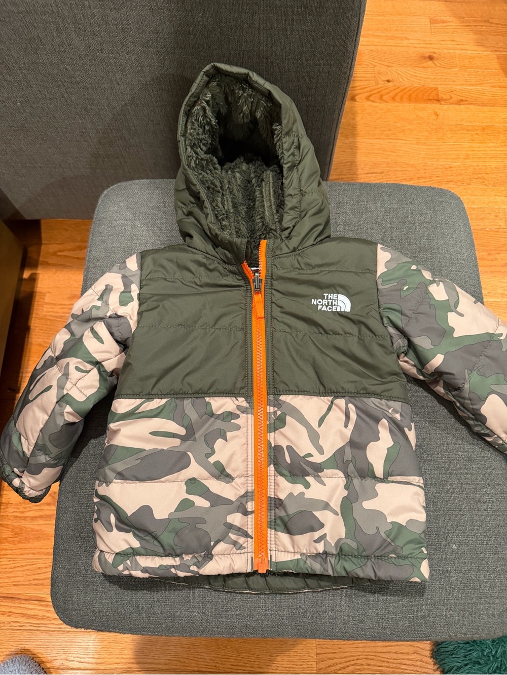 The North Face Kids Olive Green Camo Puffer Jacket with Orange Zipper